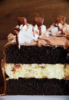 a piece of cake with chocolate frosting and marshmallows