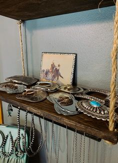 there is a shelf with jewelry on it