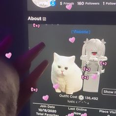 someone is holding up their cell phone to show the cat on it's screen