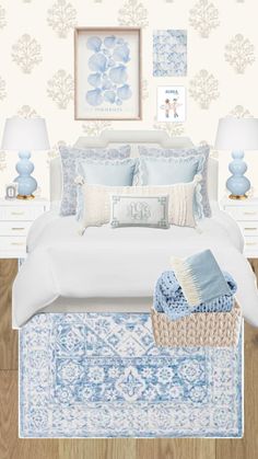 a bedroom with blue and white decor on the walls, bedding and rugs