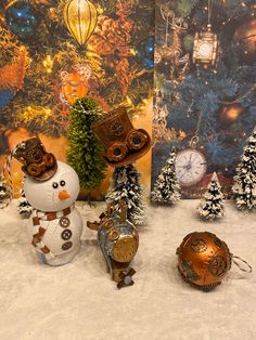 a snowman and two clocks in front of a christmas tree