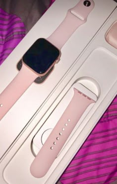 an apple watch is in its box on the bed