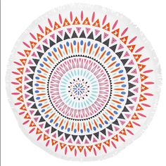 a round beach towel with an orange and blue design on the front, white background