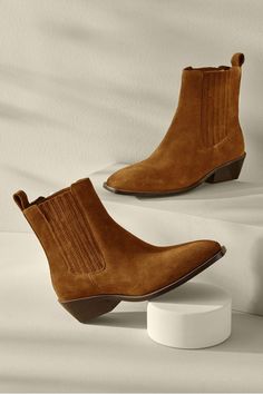 Add a little edge to everyday outfits with these Western-inspired boots. The square toe lends versatility and the elastic gore plus pull tab make slipping on and off a breeze. They look the part worn with everything from a dress to jeans. 8.75 in shaft. 1.5 in stacked heel. Leather or suede upper/synthetic sole. Carmel Color, Ankle Boots Dress, The Square, Hold Me, Soft Surroundings, Seychelles, Pull Tab, Stacked Heel, Dress With Boots