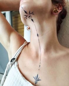 a woman with a tattoo on her neck