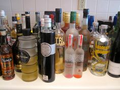 there are many different types of alcohol on the counter