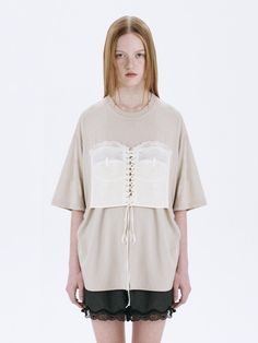 This is a trendy and casual top by MARGESHERWOOD that is made out of high quality and sturdy material. With distinctive mood of the design and comfortable wear, you can style it for your casual daily outfit.- Relaxed oversized silhouette- Corset detail with eyelets and strings- Cotton 100% pigment fabric Beige Short Sleeve T-shirt For Loungewear, Chic Cotton T-shirt For Layering, Spring Oversized Beige T-shirt, Cream Relaxed Fit Top For Loungewear, Oversized Crew Neck Spring Tops, Neutral Cotton Tops With Relaxed Fit, Oversized Crew Neck Blouse For Layering, Oversized Cream Top For Loungewear, Cream Crew Neck Top For Loungewear