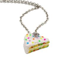 "Confetti cake is a birthday classic, and it's as fun to wear as to eat!  I handmade this tiny confetti cake charm out of polymer clay & resin with attention to detail. This necklace is very realistic with its moist yellow cake dotted with confetti cake's signature rainbow spots and layered with yummy buttercream frosting. It's topped with tiny rainbow confetti sprinkles for a festive finish! The charm is glazed for shine and protection and is about 3/4\" long. Comes on a stainless steel 18\" cable chain.  Matching earrings>> https://www.etsy.com/listing/240584535/confetti-cake-earrings-birthday-cake?ref=shop_home_active_1 **Made to Order- Please allow 2 weeks from time of purchase until item ships** Every order comes with free gift packaging! Please contact me with any questions you may h Playful Polymer Clay Jewelry For Birthday, Novelty Resin Jewelry For Birthdays, Novelty Multicolor Necklaces For Birthdays, Multicolor Novelty Necklaces For Birthdays, Birthday Cake Slice, Funfetti Birthday Cake, Funfetti Birthday, Silver Food, Moist Yellow Cakes