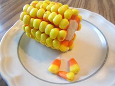 a plate with candy corn on the cob