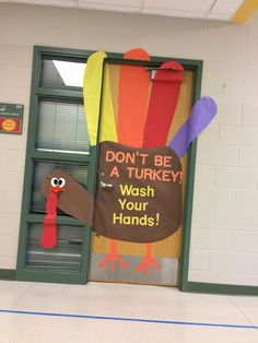 a door with a turkey on it that says don't be a turkey wash your hands