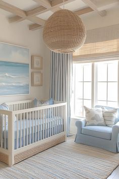 a baby's room with a couch, crib and painting on the wall