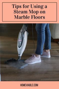 a woman using a steam mop on marble floors with text overlay reading tips for using a steam mop on marble floors