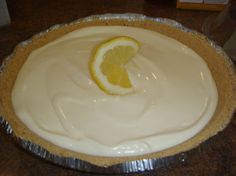 a lemon pie sitting on top of a table