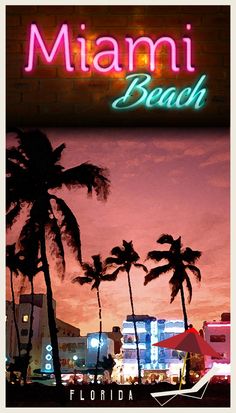 the miami beach sign is lit up at night with palm trees and buildings in the background