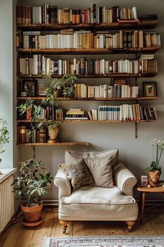 a living room filled with furniture and lots of books on the shelves above it's head