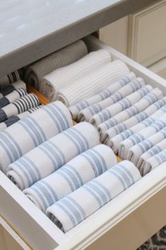 folded towels are stored in an organized drawer