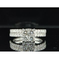 a diamond ring with two rows of diamonds on top and bottom, set in 18k white gold