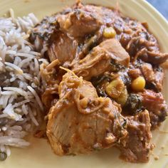 a yellow plate topped with rice and meat