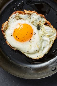 an egg is fried in a frying pan