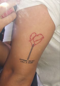 a woman's arm with a tattoo on it that says nothing is easy like a heart