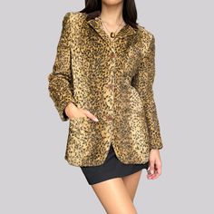 Vintage Italian short coat in faux fur look. Soft, cozy leopard print made from 62% cotton and 38% viscose. Lining consisting of viscose. Size 44 - but wears like an S. Johnny Lambs brand. Velvet collar. Button closure. / Length / 68 cm / Sleeve length / 55 cm / Shoulder width / 40 cm The model is size XS and is 160 cm tall. Fall Leopard Print Faux Fur Coat, Fall Leopard Print Fur Coat With Faux Fur Lining, Leopard Print Fur Coat With Faux Fur Trim, Vintage Leopard Print Winter Outerwear, Fitted Faux Fur Outerwear In Leopard Print, Vintage Leopard Print Outerwear For Winter, Fitted Leopard Print Faux Fur Outerwear, Fitted Leopard Print Fur Coat For Fall, Vintage Long Sleeve Leopard Print Outerwear