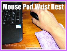 a person using a mouse on a desk with the words mouse pad wrist rest above it