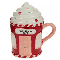 a ceramic coffee mug with a christmas cafe on it