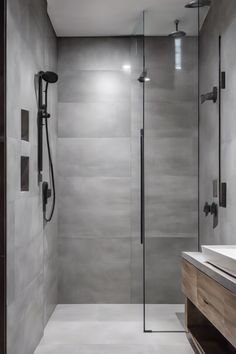 Modern bathroom with a walk-in shower featuring a sleek design and a wall-mounted rain showerhead. Wet Room Ideas, Teak Shower Floor, Wet Bathroom, Wet Room Bathroom, Sunroom Furniture, Water Resistant Flooring, Wet Room Shower, Wet Room, Shower Niche