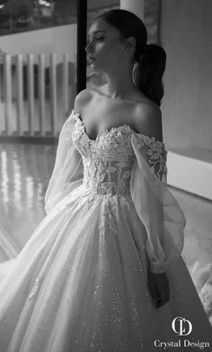 black and white photo of a woman in a ball gown