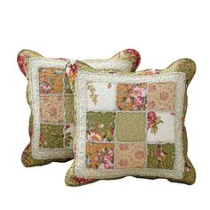 two pillows with patchwork on them, one has flowers and the other is green