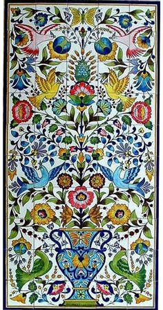 an intricately decorated tile with flowers and birds in blue, green, yellow and red colors