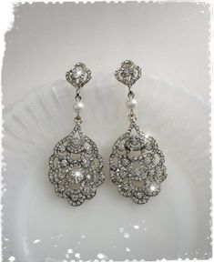 "Art Deco - The Great Gatsby, Downton Abbey inspired crystal peacock fan long earrings. Beautiful and very sparkling dangle chandelier earrings are made of brilliant Clear Austrian Crystals in 18K gold plated alloy settings with Swarovski Pearl (photo No.1 & 2 shown in \"White gold plated\" with Swarovski \"White\" pearl). Photo No.3 \"Champagne gold\" is yellow gold has peach hue (between yellow and rose gold). Please note that product colors in photos may appear slightly different on vario Crystal Jeweled Bridal Earrings For Wedding, Wedding Crystal Jeweled Chandelier Earrings, Crystal Jeweled Chandelier Earrings For Wedding, Elegant Jeweled Chandelier Earrings For Wedding, Jeweled Crystal Earrings For Weddings, Elegant Jeweled Crystal Earrings For Wedding, Crystal Embellished Bridal Drop Earrings For Wedding, Crystal Embellished Bridal Drop Earrings, Silver Jeweled Bridal Earrings