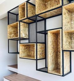 the shelves are made out of plywood and metal mesh, along with wooden flooring