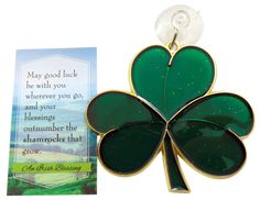 a four leaf clover brooch with a card for st patrick's day