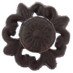 a black flower shaped object on a white background