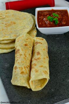 tortillas and salsa are on the table ready to be eaten