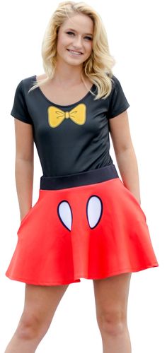 a woman in a mickey mouse costume posing for the camera with her hands on her hips