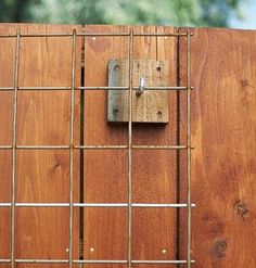 a piece of wood with metal bars attached to it