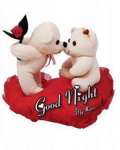 two white teddy bears sitting on top of a red heart with the words good night my love