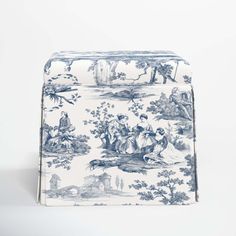 a blue and white toiler print bag on a white background with an image of people in the woods