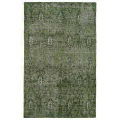 a green rug with an intricate design on the top and bottom, it is made out of