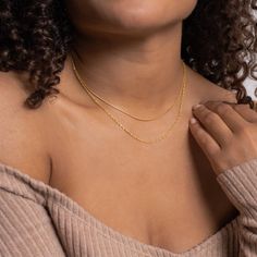 Layering just got easier with the Monet Duo Chain. A dainty snake chain sits atop a sparkling twist chain, otherwise known as a Singapore chain. An effortless and edgy layered look is just one clasp away. Material: High Quality Solid 925 Sterling Silver Finish: Sterling Silver ∙ 18K Gold Featuring a Minimalist Layered Necklace Set with a 14 inch Snake Chain layered with a 15 inch Singapore Chain, length is adjustable up to 2 inches SKU: RR-NR066 Double Snake Chain Necklace, Dainty Snake Chain Necklace For Layering, Minimalist Snake Chain Layered Necklace, Trendy Layered Snake Chain Necklace With Delicate Details, Snake Chain Necklace With Double Chain For Layering, Double Chain Snake Necklace For Layering, Layering Snake Chain Necklace, Minimalist Snake Chain Necklace For Layering, Trendy Everyday Delicate Snake Chain Necklace