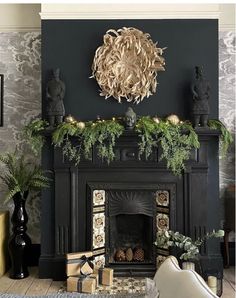 a living room filled with furniture and a fire place covered in greenery next to a fireplace