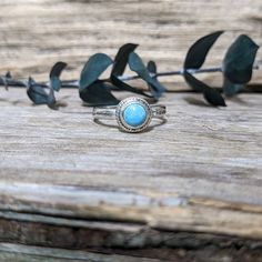 This dainty, stackable, turquoise ring was made with Argentium Silver and Turquoise. The ring band is lightly textured. The bezel setting features twisted wire for an added detail. The 6mm round cabochon is American Mined Turquoise. This ring was lightly oxidized and is approximately a size 6.5 - 6.75. Adjustable Turquoise Bohemian Crystal Ring, Adjustable Bohemian Turquoise Promise Ring, Nickel-free Southwestern Style Ring As Gift, Blue Turquoise Stackable Round Ring, Nickel Free Southwestern Style Ring As Gift, Stackable Round Turquoise Ring In Blue, Bohemian Stackable Blue Turquoise Ring, Bohemian Blue Stackable Turquoise Ring, Bohemian Nickel-free Promise Ring