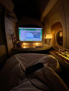 an airplane bedroom with a flat screen tv