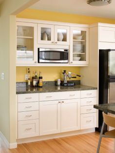 the kitchen is clean and ready for us to use as a dining room or office