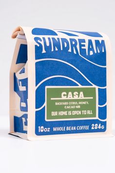 a blue and white coffee bag with the words sundream on it's side