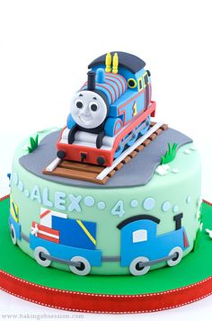 a thomas the train birthday cake with fondant decorations