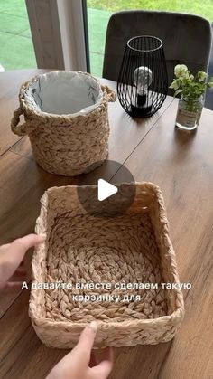 two baskets sitting on top of a wooden table