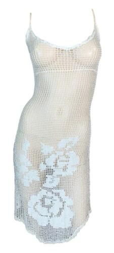 a white tank top with flowers on the front and back, made out of mesh